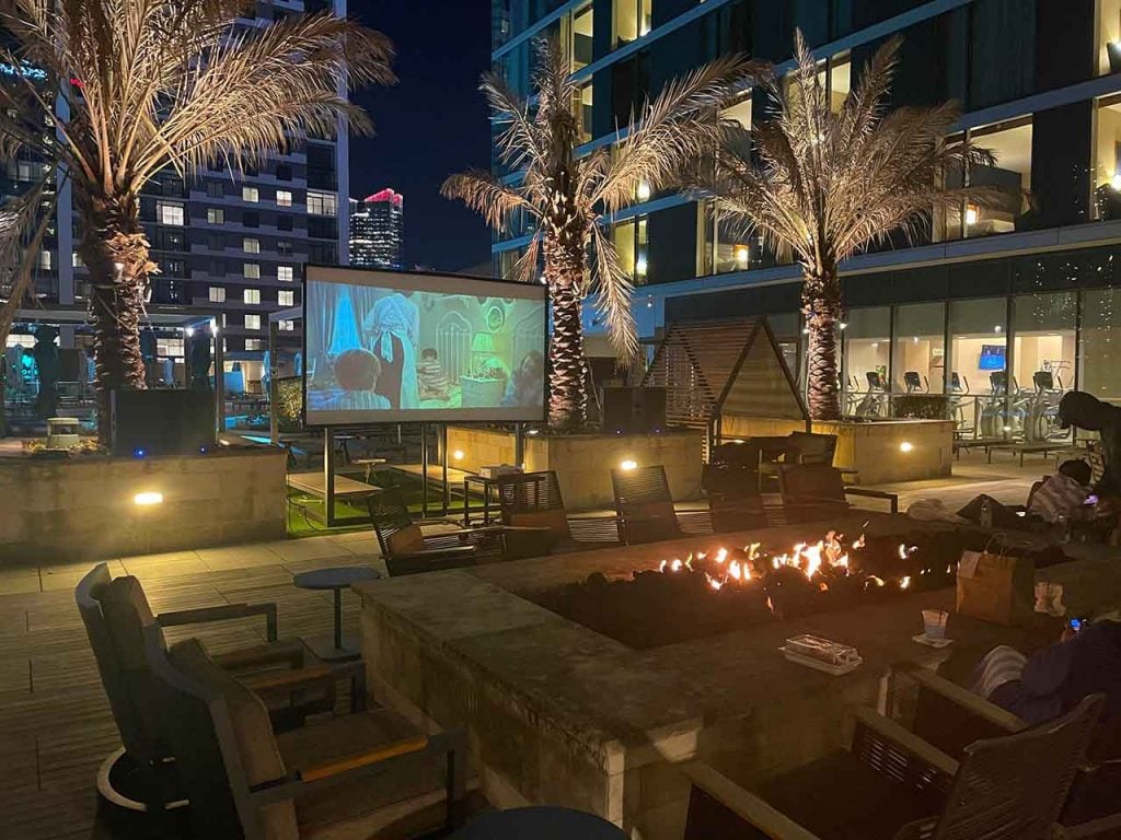 Sitting down for Mary Poppins during movie night at the Altitude Rooftop & Pool.