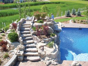 Water features tie together the hardscape of the pool to the softscape of the backyard.