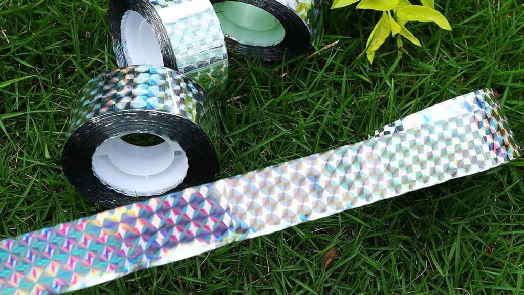 Scare Tape - Reflective Ribbon - Bird, Squirrel, Raccoon Repellent for Pools & Backyards