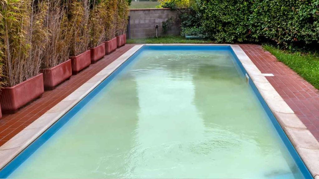 Warm temperatures and bad water chemistry can lead to green cloudy water in your pool.