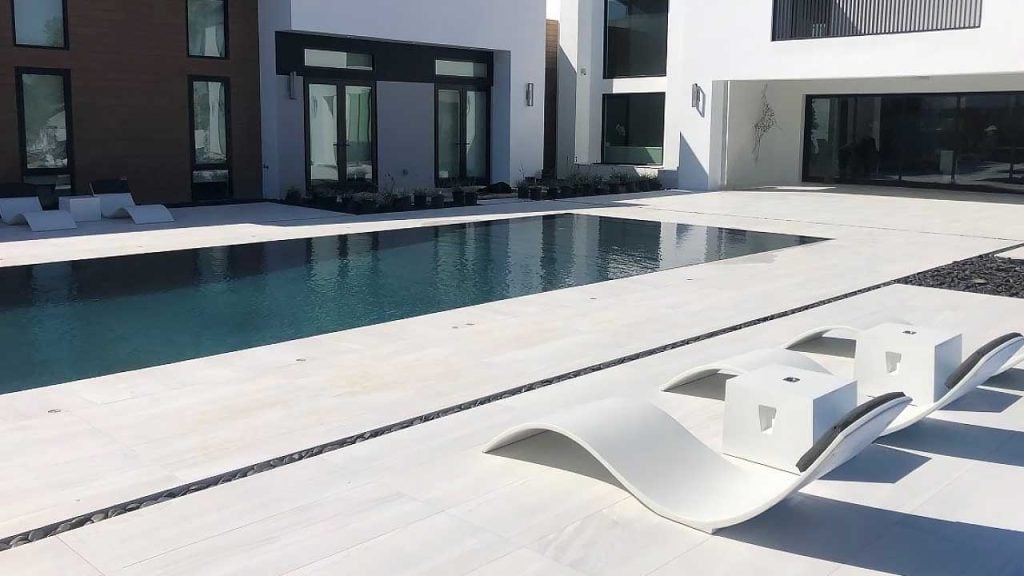 Studio Redrock’s Curve II concrete pool and patio loungers.